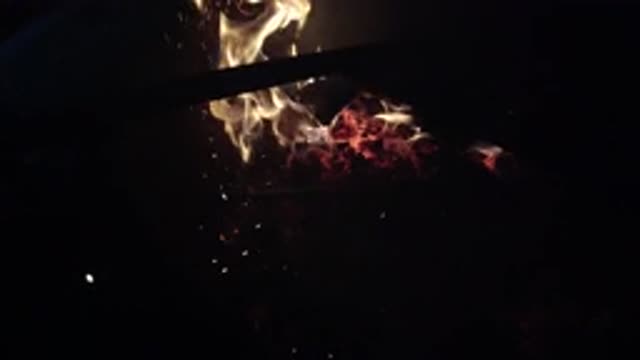OJAI CALIFORNIA-2019: Fireplace Lit With Ember And Intense Fire Flying Near