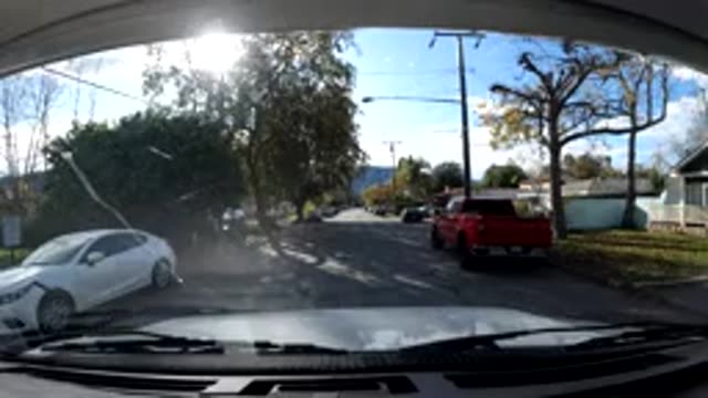 OJAI CALIFORNIA-2019: First Person Driving Past A Strip Mall And Parking In