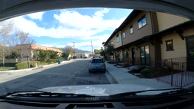 OJAI CALIFORNIA-2019: Street With Few Cars And Little Movement Under A Blue Sky