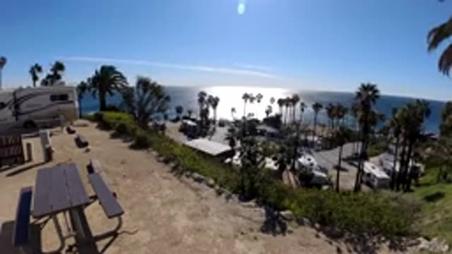 MALIBU CALIFORNIA-2019: Time Lapse Of A Beachside View With Palm Trees And The Sun