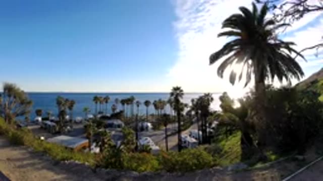 MALIBU CALIFORNIA-2019: Time Lapse Camera Filming Ocean And Palm Trees