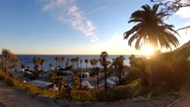 MALIBU CALIFORNIA-2019: Ocean And Beach With Trees And Sky And Clouds