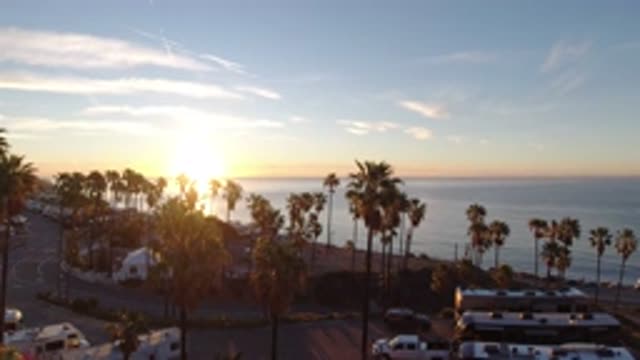 MALIBU CALIFORNIA-2019: Sunset Over A River Surrounded By Trees And Cars