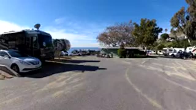 MALIBU CALIFORNIA-2019: Motorhomes Parking Near Road with Crowded Vacationers
