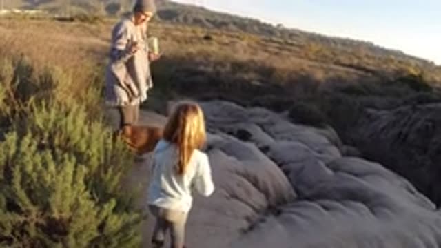 SAN CLEMENTE CALIFORNIA-2019: Mom And Daughter Standing In A Field On A Hike