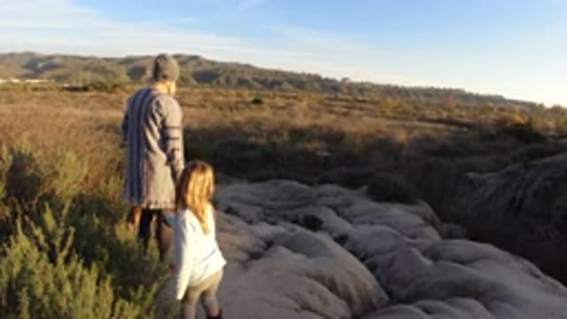 SAN CLEMENTE CALIFORNIA-2019: Mother And Daughter Looking At A Flat Landscape