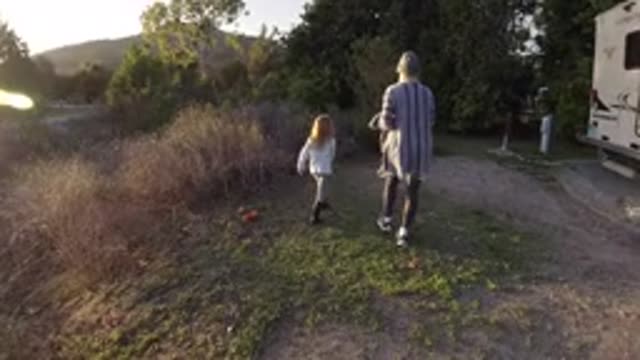 SAN CLEMENTE CALIFORNIA-2019: A Mother And Young Daughter Walk With A Dog Next