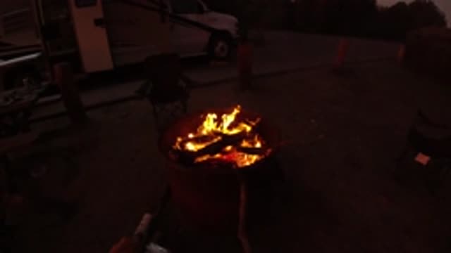 SAN CLEMENTE CALIFORNIA-2019: Outdoor Fire Crackles With Van In Background