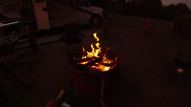 SAN CLEMENTE CALIFORNIA-2019: Wood Burning Strong Inside A Burn Barrel At A Campsite