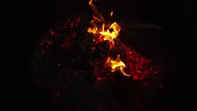 SAN CLEMENTE CALIFORNIA-2019: A Slow Motion Campfire And Coals Burning At Night