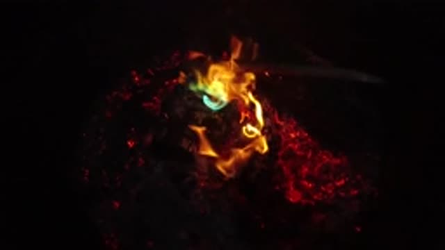 SAN CLEMENTE CALIFORNIA-2019: Slow Motion Fire And Embers With Both Green And Orange