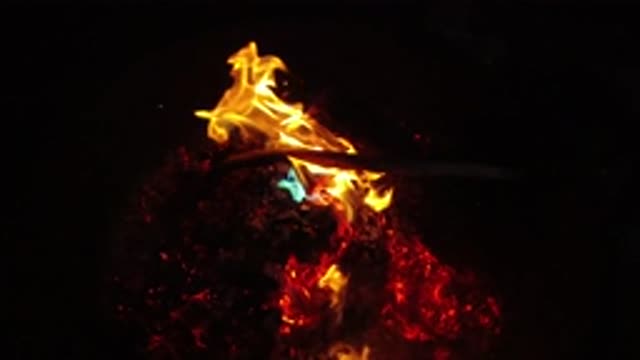 SAN CLEMENTE CALIFORNIA-2019: Flames In A Dark Surrounding Possibly A Fireplace