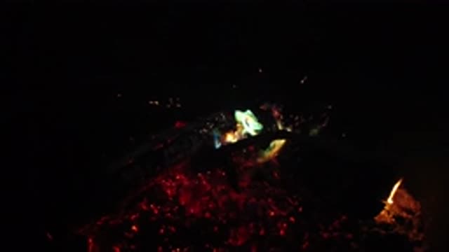 SAN CLEMENTE CALIFORNIA-2019: Pile Of Logs Burning In A Fire Pit At Night
