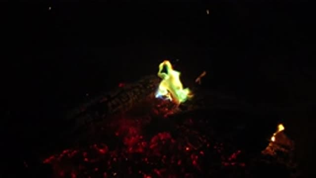 SAN CLEMENTE CALIFORNIA-2019: Yellow And Green Flames With Red Embers In Black