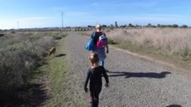 SAN CLEMENTE CALIFORNIA-2019: Two People Walking Down A Dirt Road