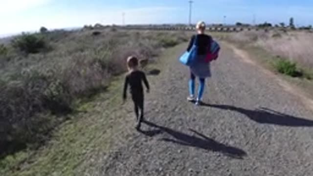 SAN CLEMENTE CALIFORNIA-2019: Mother And Daughter Walk The Stone Road In Company