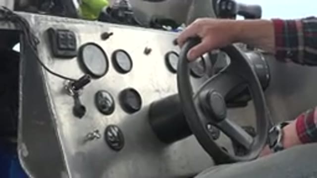 RED LAKE CANADA-2015: Hand On Steering Wheel Of Vehicle Drivers Legs React To Rough Road