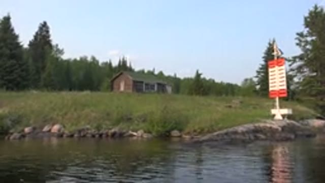 RED LAKE CANADA-2015: Slow Pan Across House Among Big Trees Beautiful River And