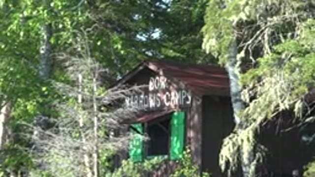 RED LAKE CANADA-2015: Cabin With Green Shutters In The Woods During Summer Camp