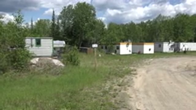 RED LAKE CANADA-2015: Two Workers Trying To Solve Tier Issue