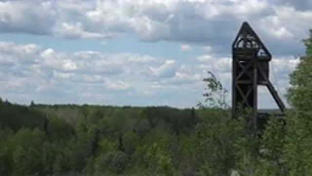 RED LAKE CANADA-2015: A Nice Green Forest And The Clear Sky With Clouds