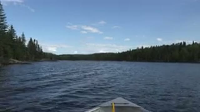 RED LAKE CANADA-2015: Boat Quickly Sailing On A River In The Middle Of The