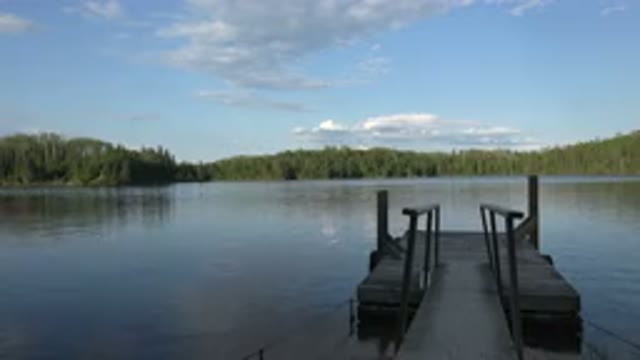 RED LAKE CANADA-2015: Peaceful Afternoon at a Pier on a Calm Lake