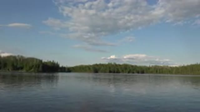 RED LAKE CANADA-2015: Panoramic View of Calm Waters Surrounded by Green Forest