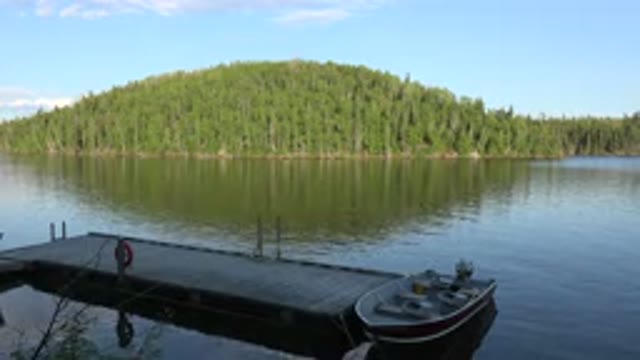 RED LAKE CANADA-2015: Lake And A Mountain That Is Covered In Trees