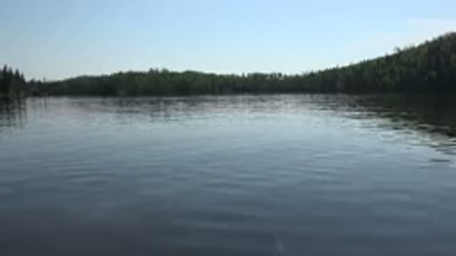 RED LAKE CANADA-2015: A Crystal Clear Blue Body Of Water And Trees