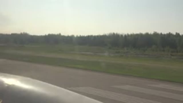 RED LAKE CANADA-2015: Plane With Running Engine Standing On The Runway