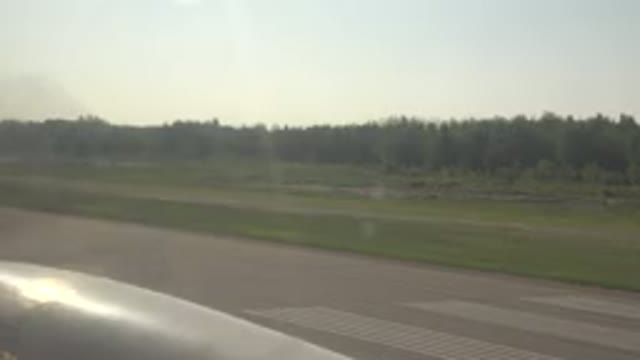 RED LAKE CANADA-2015: Airplane Propeller Spinning Against A Scenic Background