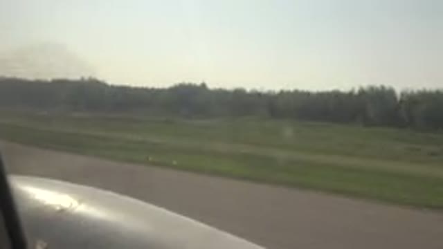 RED LAKE CANADA-2015: Passing Green Fields And Trees On A Clear Day