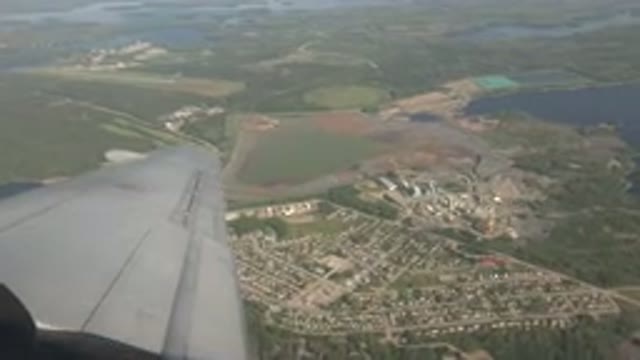 RED LAKE CANADA-2015: A Camera Recording On The Inside Of A Plane Of The View On