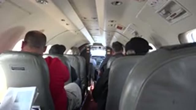 RED LAKE CANADA-2015: View From Inside Airplane Of Passengers In Rows Ahead One