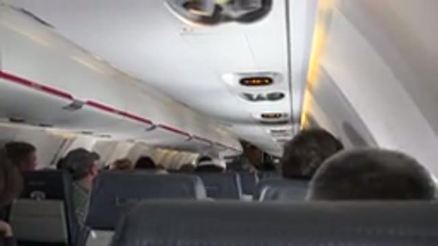 WINNIPEG CANADA-2015: Flight On The Airplane Sitting Flight Attendant Full