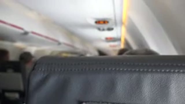 WINNIPEG CANADA-2015: Secret Camera Recording Of Gossip On A Plane With Facial