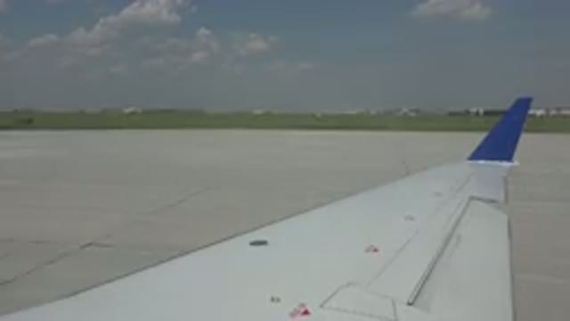 WINNIPEG CANADA-2015: Airplane Slowly Landing On A Tarmac At An Airport