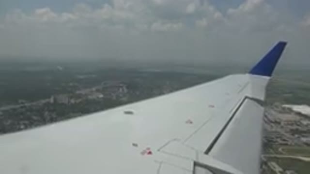 WINNIPEG CANADA-2015: A Plane Wing Flying in the Sky