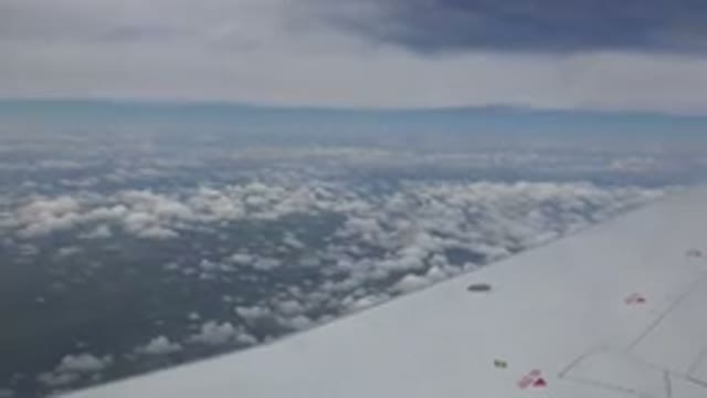WINNIPEG CANADA-2015: Aerial View of Plane Wing and Clouds During Flight