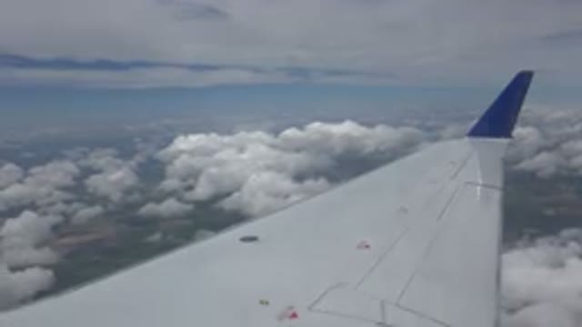 WINNIPEG CANADA-2015: View Out Airplane Window In Flight Of Wing Ground And