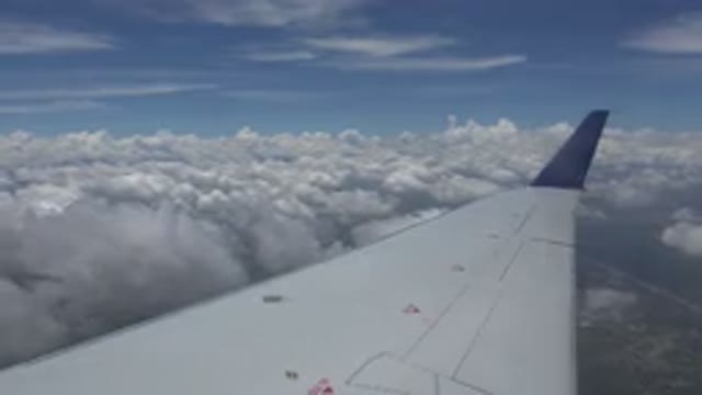 WINNIPEG CANADA-2015: View From Airplane Window In Flight Over Ground And Clouds