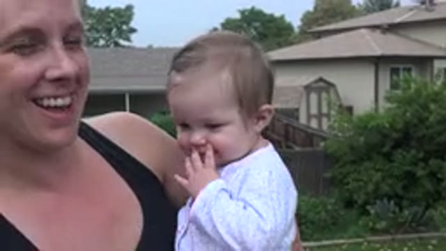 WESTMINSTER COLORADO-2015: A Woman Carrying A Baby Girl In Her Arms Both Laughing