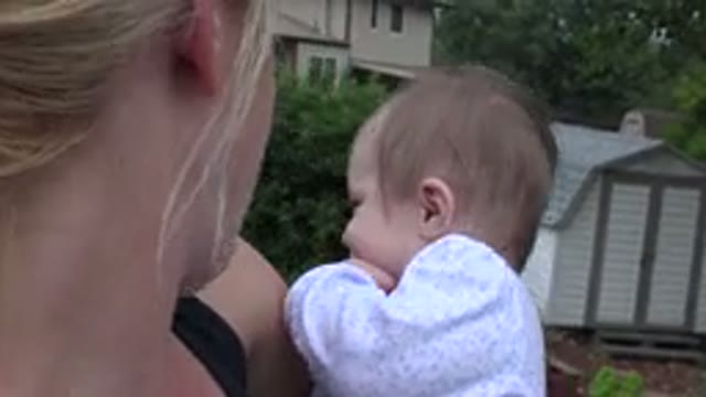 WESTMINSTER COLORADO-2015: A Happy Mother Holds Her Child In Her Arms And Talks