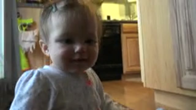 WESTMINSTER COLORADO-2015: Beautiful Little Baby Stares At Camera Indoor With Father