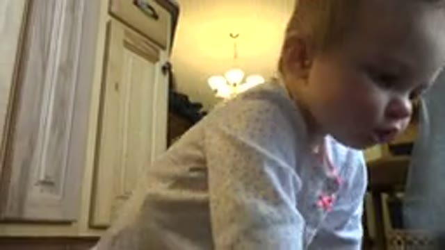 WESTMINSTER COLORADO-2015: Cute Little Baby Crawling On The Floor With A Woman