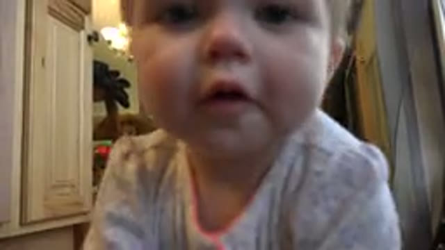 WESTMINSTER COLORADO-2015: A Small Blonde Girl Crawling and Reaching for the Camera