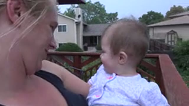WESTMINSTER COLORADO-2015: Mother Joyfully Holds Her Baby Daughter