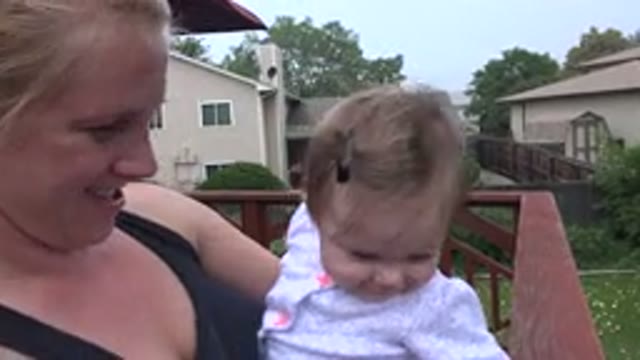WESTMINSTER COLORADO-2015: A Happy Mother And A Cheerful Baby In Moms Arms