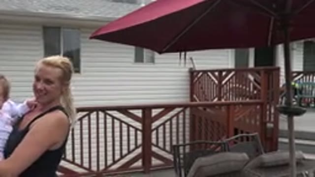 WESTMINSTER COLORADO-2015: Mom And Daughter Standing On A Patio Enjoying The Sun
